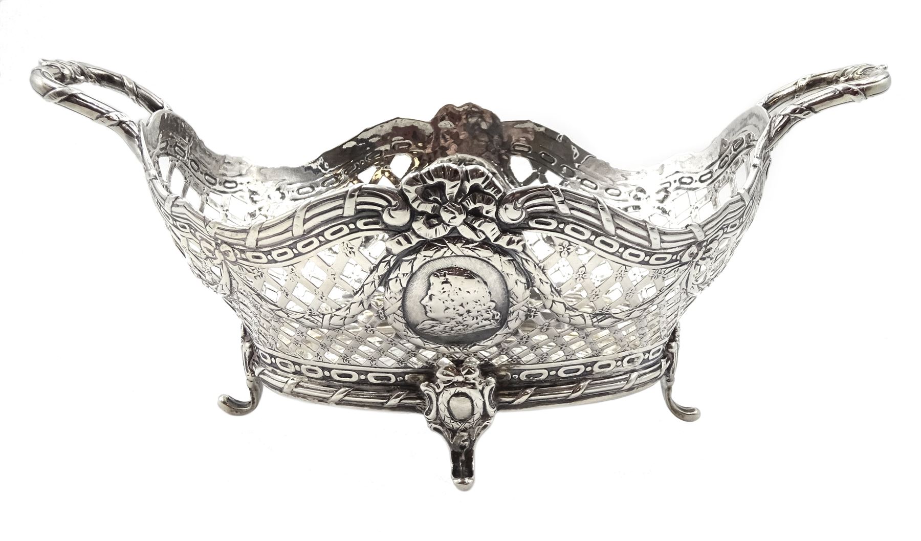 19th century pseudo Hanau silver, George II style twin handled basket with embossed busts, draped ribbon and pierced lattice work decoration, imported by William Moering, London 1897, approx 14.5oz