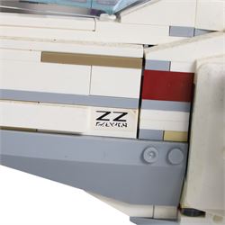 Three Lepin Star Wnrs built models, comprising Red Five X-Wing Starfighter no. 05039, Millennium Falcon no. 05132 and Super Star Destroyer no. 05028