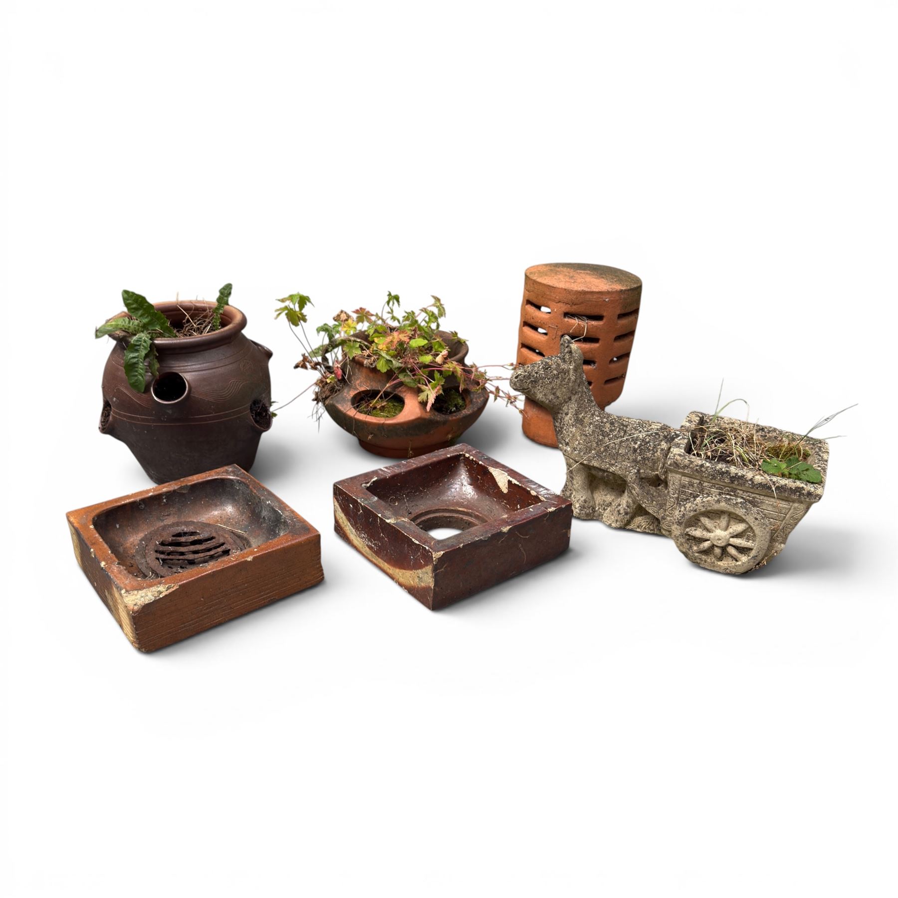 Collection of garden platers including two strawberry pots, cast stone planter, chimney top and two terracotta drain surrounds