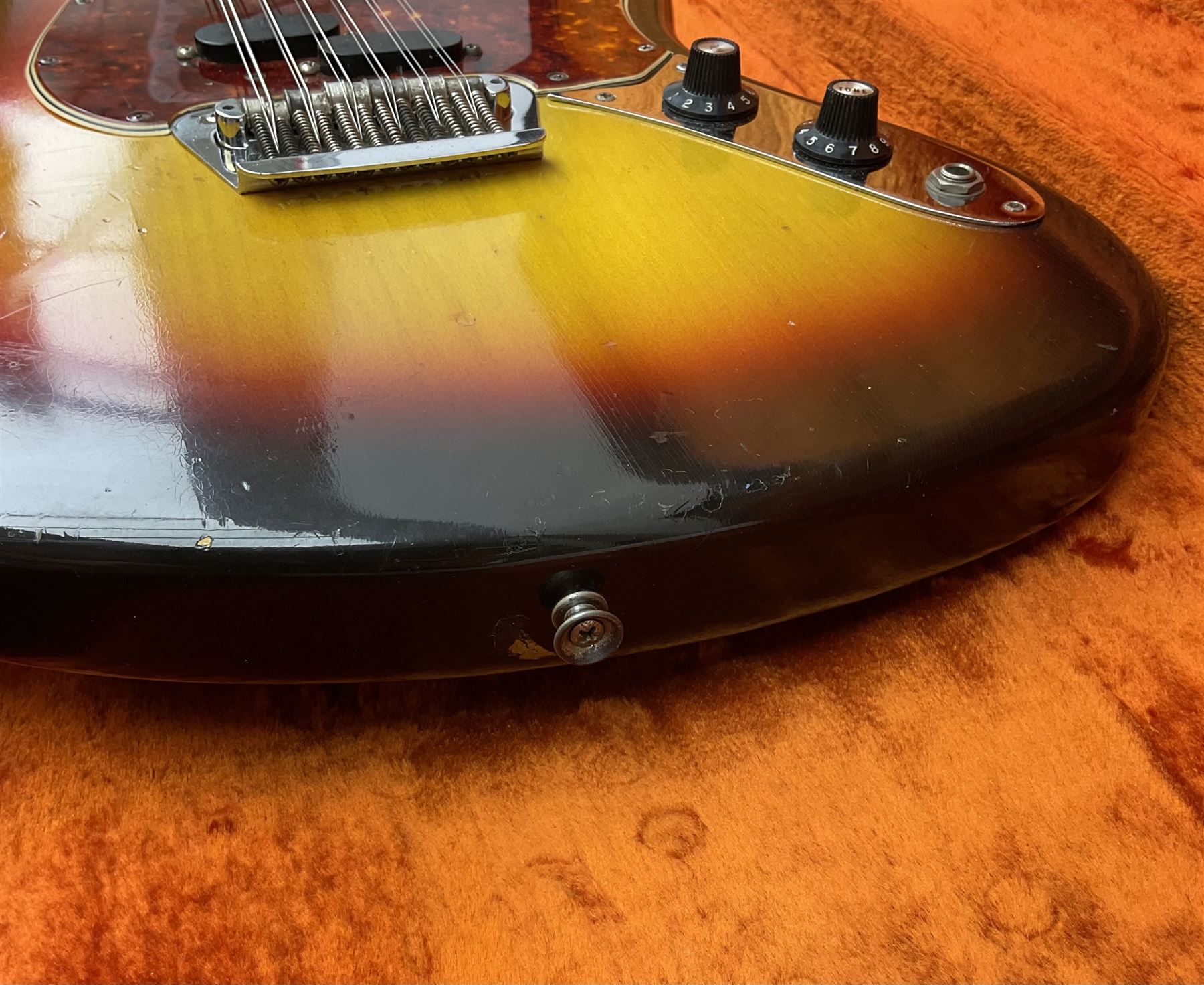 Fender three-tone Sunburst 12-string electric guitar c1965/6 Fullerton USA, with alder body and maple neck, the Indian rosewood fretboard with twenty-one frets and pearloid dot markers, fender electric XII bridge, F-stamp tuners (non-original), two split single coil pick-ups, master volume and tone and four-way switch, serial no.129730, L108cm; in original Fender case bearing label for Rivington Guitars New York with copy of original invoice; together with GuitarKes set-up and service certificate dated October 2021
