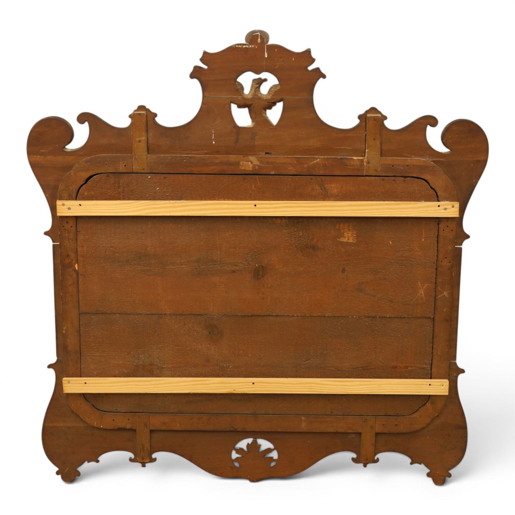 Large George III mahogany wall mirror, parcel gilt shaped frame with scrolling acanthus, shell and foliate decoration, surmounted by carved gilt ho-ho bird, rectangular mirror plate within moulded border, shaped apron with gilt scroll terminals, removed from a Scottish country estate