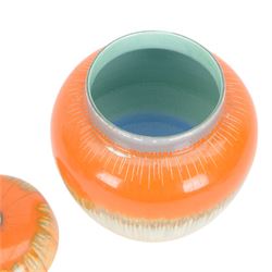 Four pieces of Shelley Harmony dripware, comparing ginger jar and three jugs, largest jug H23cm