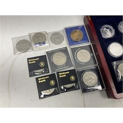 Eight sterling silver hallmarked 'Incorporated by Royal Charter' commemorative medallions, two Queen Elizabeth II 2000 five pound coins, commemorative crowns etc, housed in a coin display box