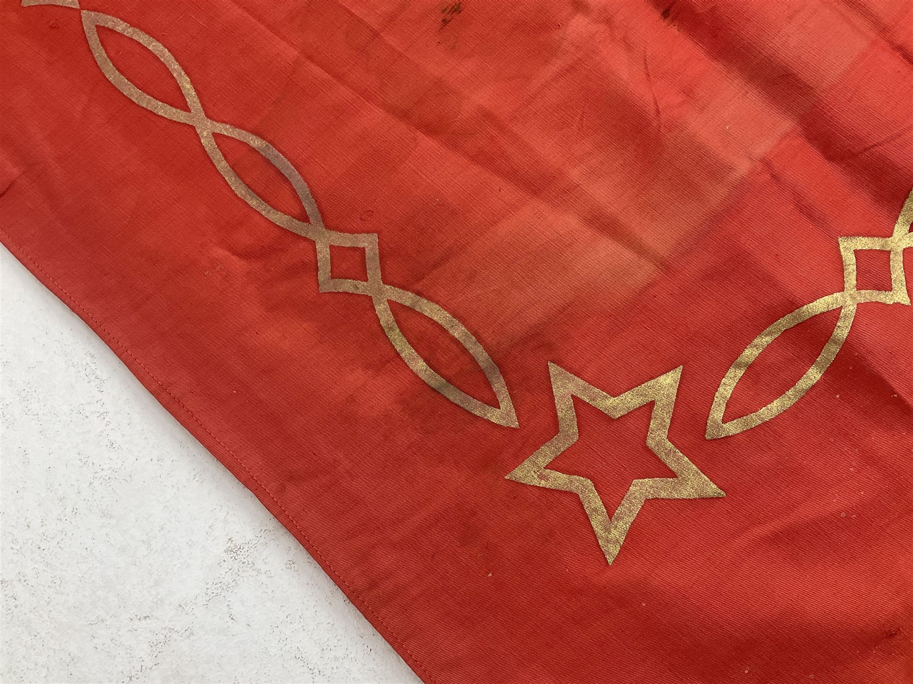 1970s Soviet banner printed in gold on a red ground, roughly translates as 'Transferable Banner - To the winner in the Socialist Competition' and 'Work Study Live by Communism' verso; wreath of wheat ears to either side; tassels on three sides 110 x 155cm