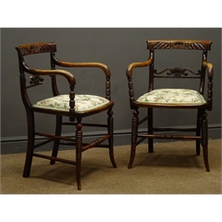  Pair Regency period stained beech elbow chairs, carved cresting rail and shaped pierced splat, upholstered seat, turned tapering splayed supports  