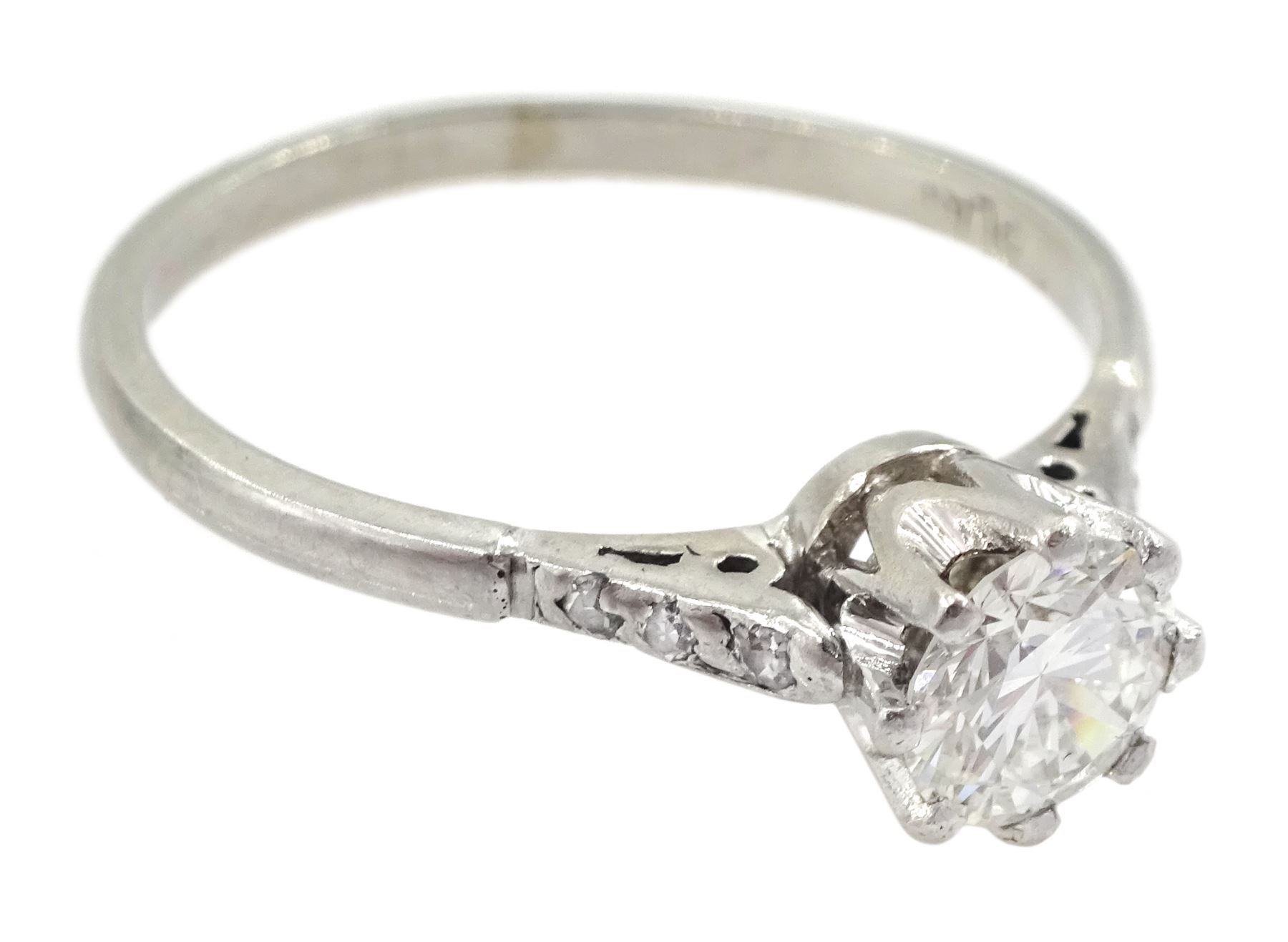 Platinum single stone round brilliant cut diamond ring, with diamond set shoulders, stamped Plat, diamond approx 0.55 carat