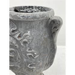 Pair lead garden urn planters, the bodies decorated with classical masks in foliage surrounds and with scrolled handles, circular stepped and leaf moulded footed bases