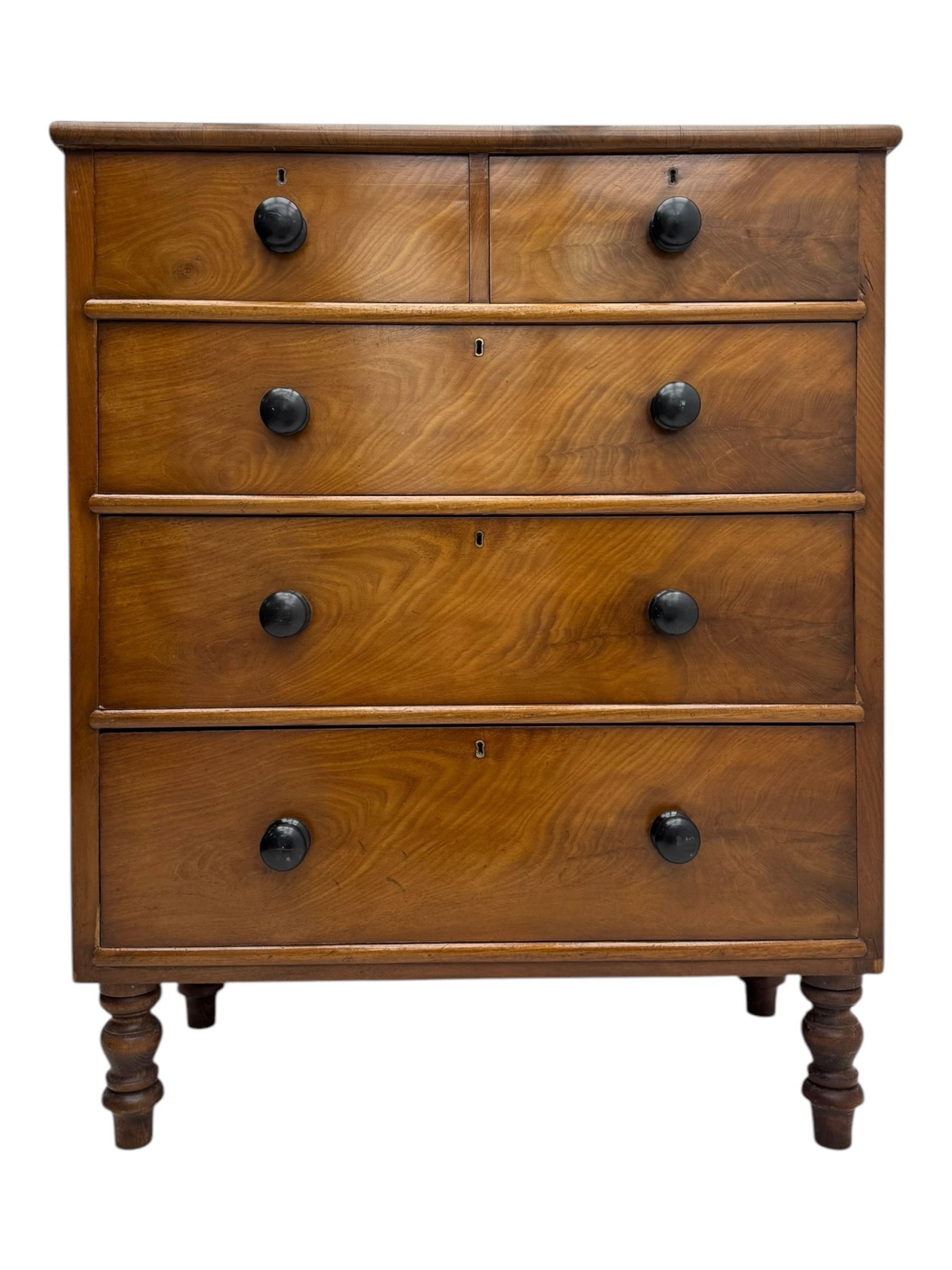 Late Victorian mahogany chest of drawers, with rectangular top over two short and three long graduated drawers, each fitted with ebonised turned knob handles and keyholes, raised on turned supports