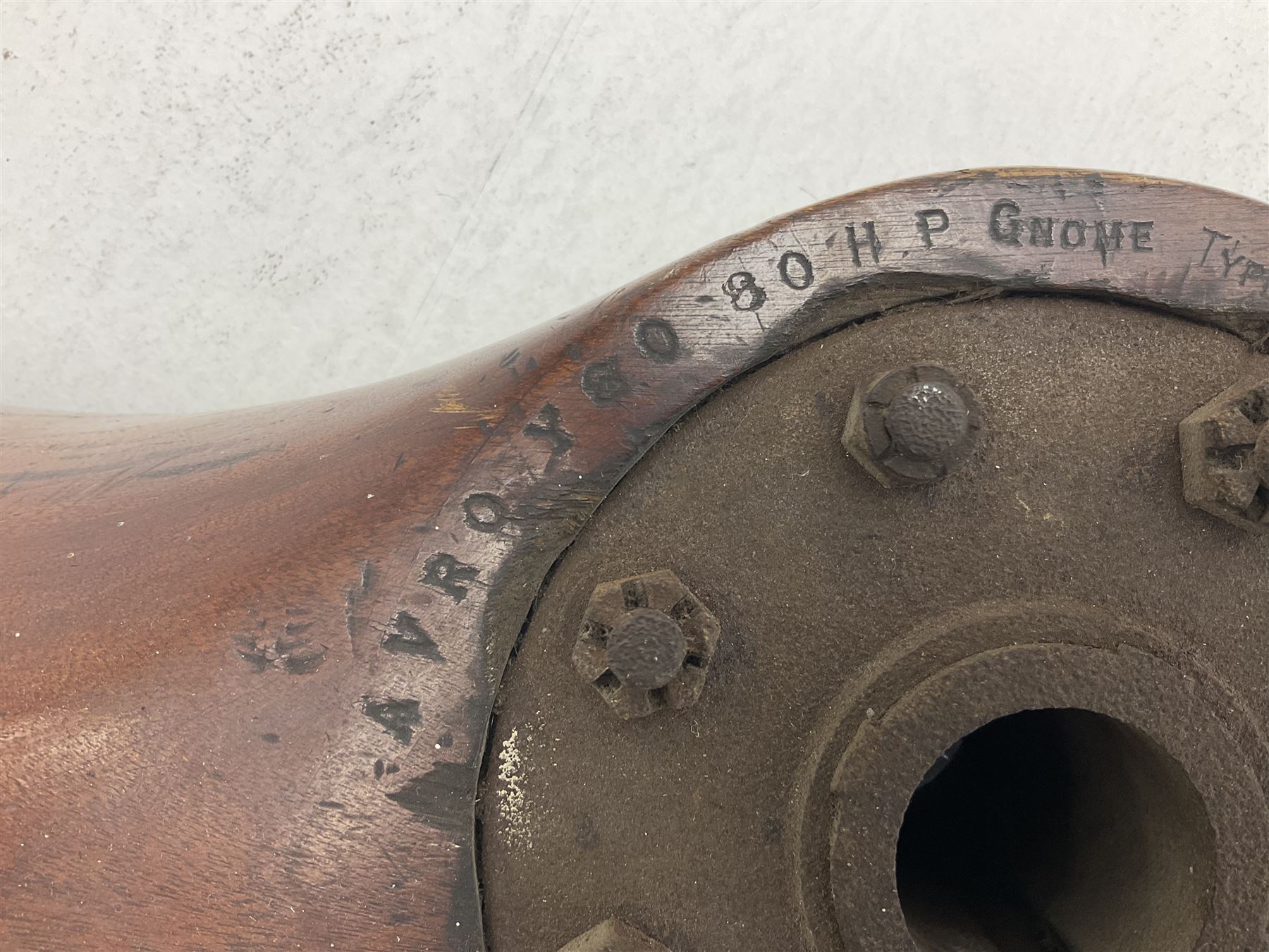 Early 20th century Avro 504 80HP Gnome laminated mahogany two-blade propeller with metal centre to the hub, stamped to the face of the hub 'AVRO Y80 80HP GNOME TYPE 504 & 504A A.I.D.29 A.I.D.32 1545' and to the sides of the hub '2744 DIA 1829 PITCH' and '1470'; traces of A.V. Roe & Co Ltd Manchester transfers to both blades L273.8cm; Auctioneer's Note: The Avro 504 was introduced in 1913 and was quickly taken up by the Royal Flying Corps as a trainer and observation machine; robust and versatile it remained in general service as a trainer until the late 1920s then widely for civilian use as a joy-rider and for stunt displays. The legendary RAF WWII ace, Douglas Bader, took instructions and would have had his first solo flight in just such a machine.