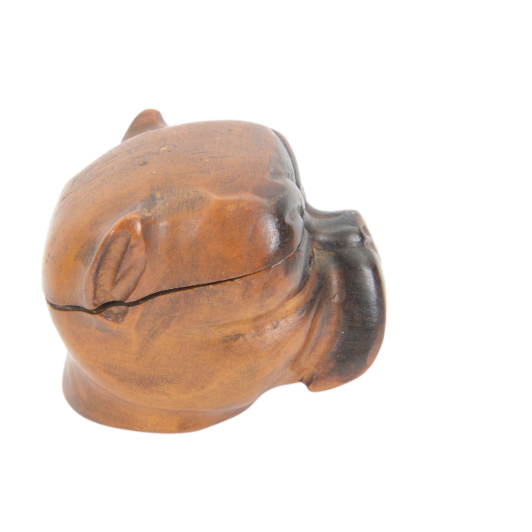 Novelty desk inkwell formed as a boat, with central chimney opening to reveal a metal inkwell with two pens formed as oars, together with another inkwell in the from of a bull dog 