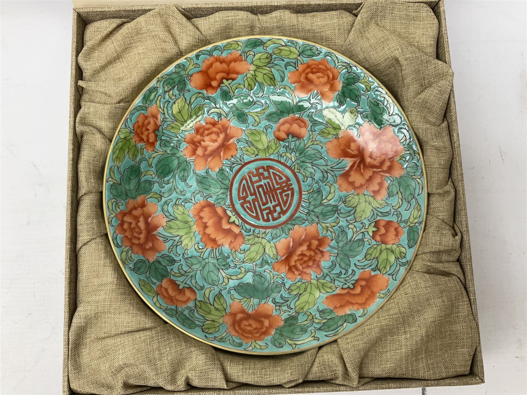 Three Chinese polychrome enamel plates each decorated with floral decoration, all marked beneath, D21cm 