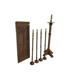 Ecclesiastical oak torchere candle stand; Small panelled oak door with foliate arch applied moulding; set four oak church spokes