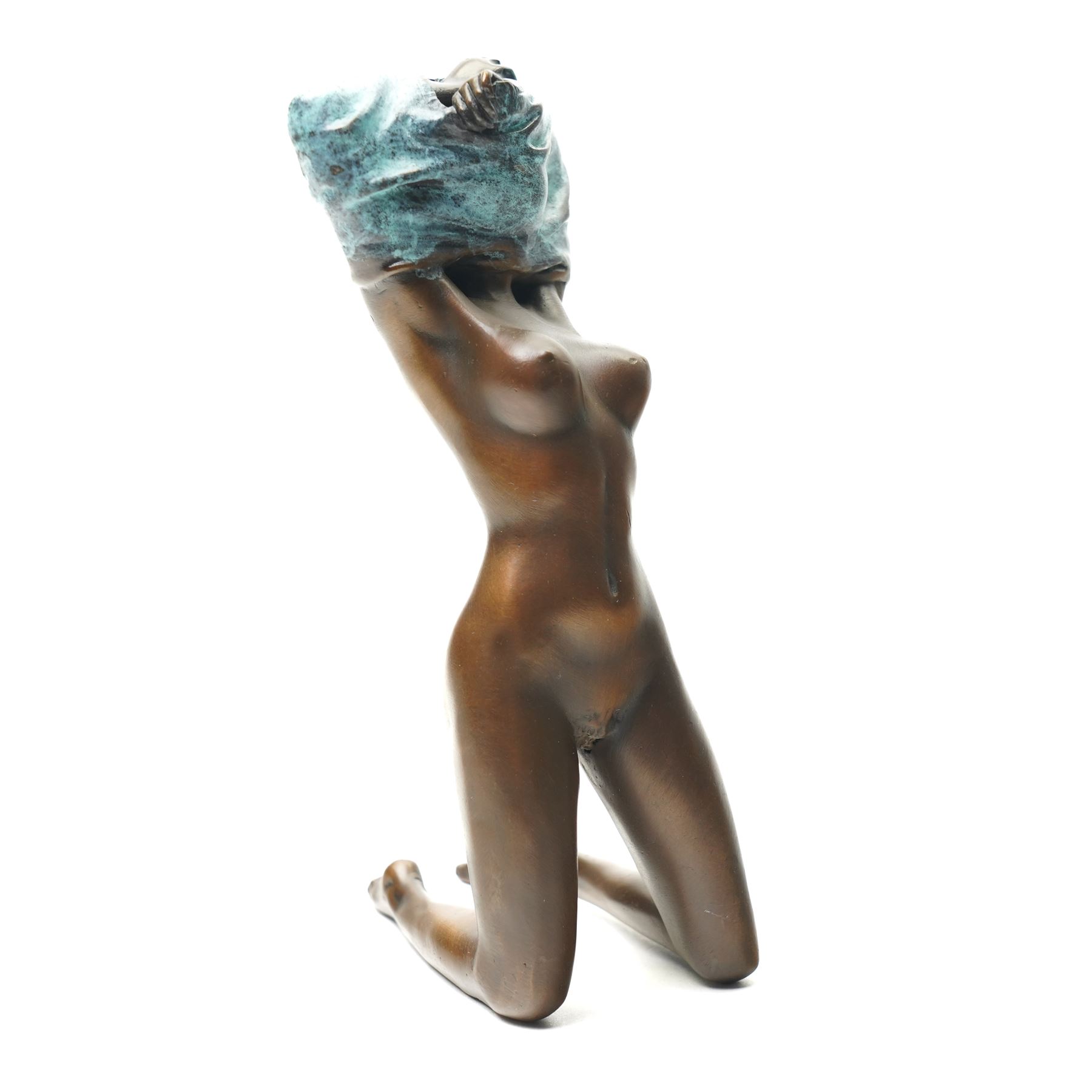 Bronze figure, modelled as a nude woman removing her shirt, signed Milo, H17cm
