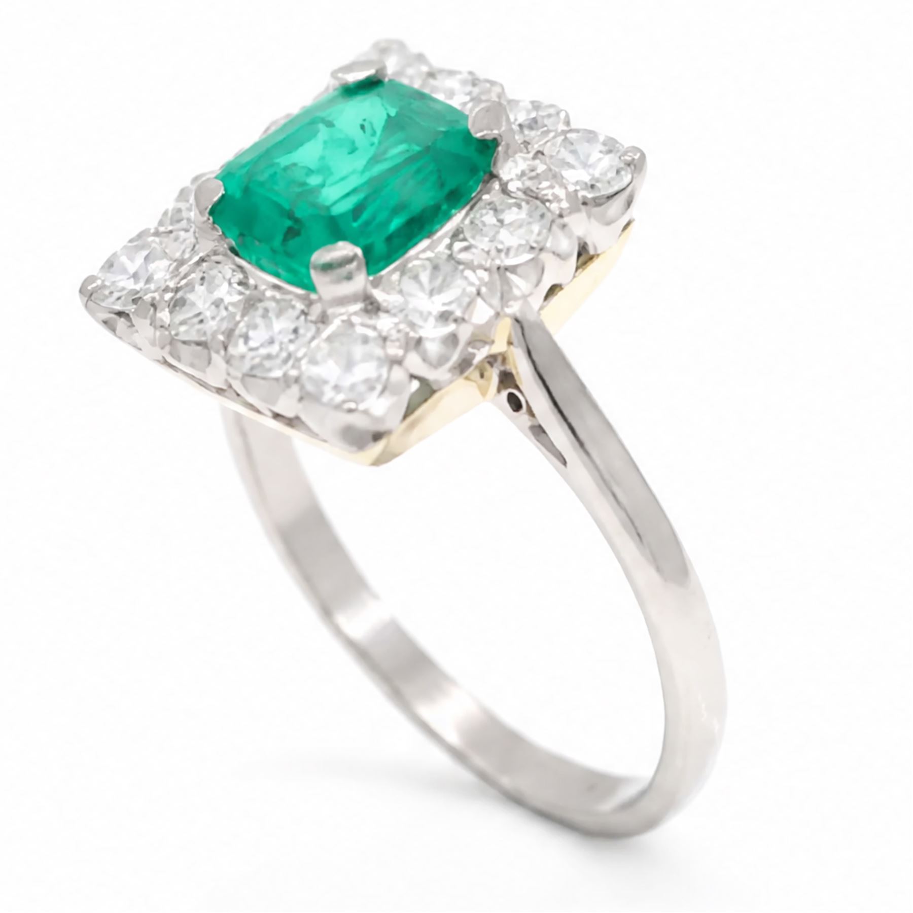 18ct white and yellow gold emerald and diamond cluster ring, single octagonal cut emerald of approx 1.55 carat, surrounded by twelve round brilliant cut diamonds, total diamond weight approx 0.95 carat