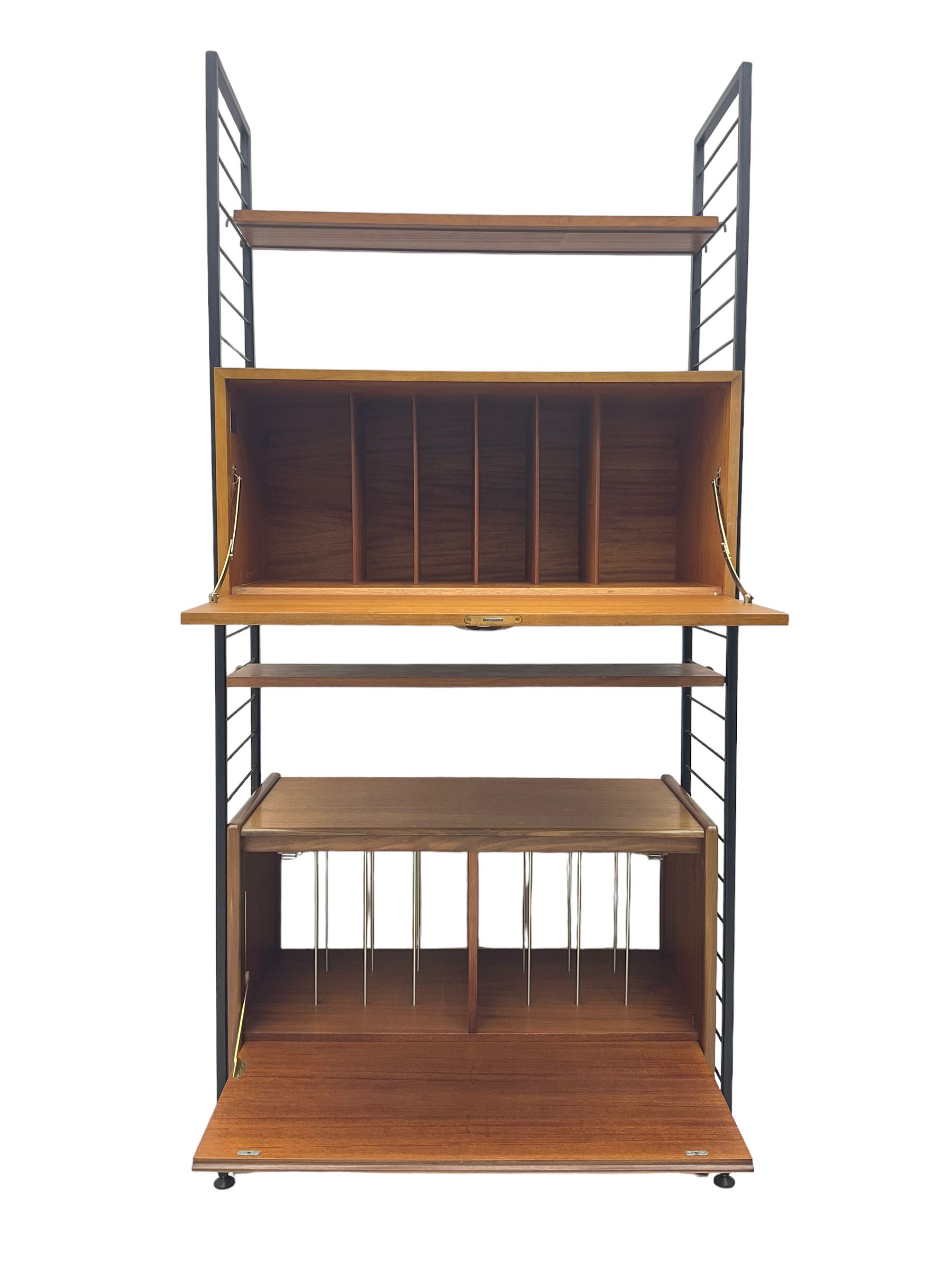 Staples Ladderax - mid-20th century teak and metal framed modular wall unit, fitted with central fall-front cupboard enclosing correspondence dividers, over secondary separate teak fall-front cupboard, adjustable shelf to top