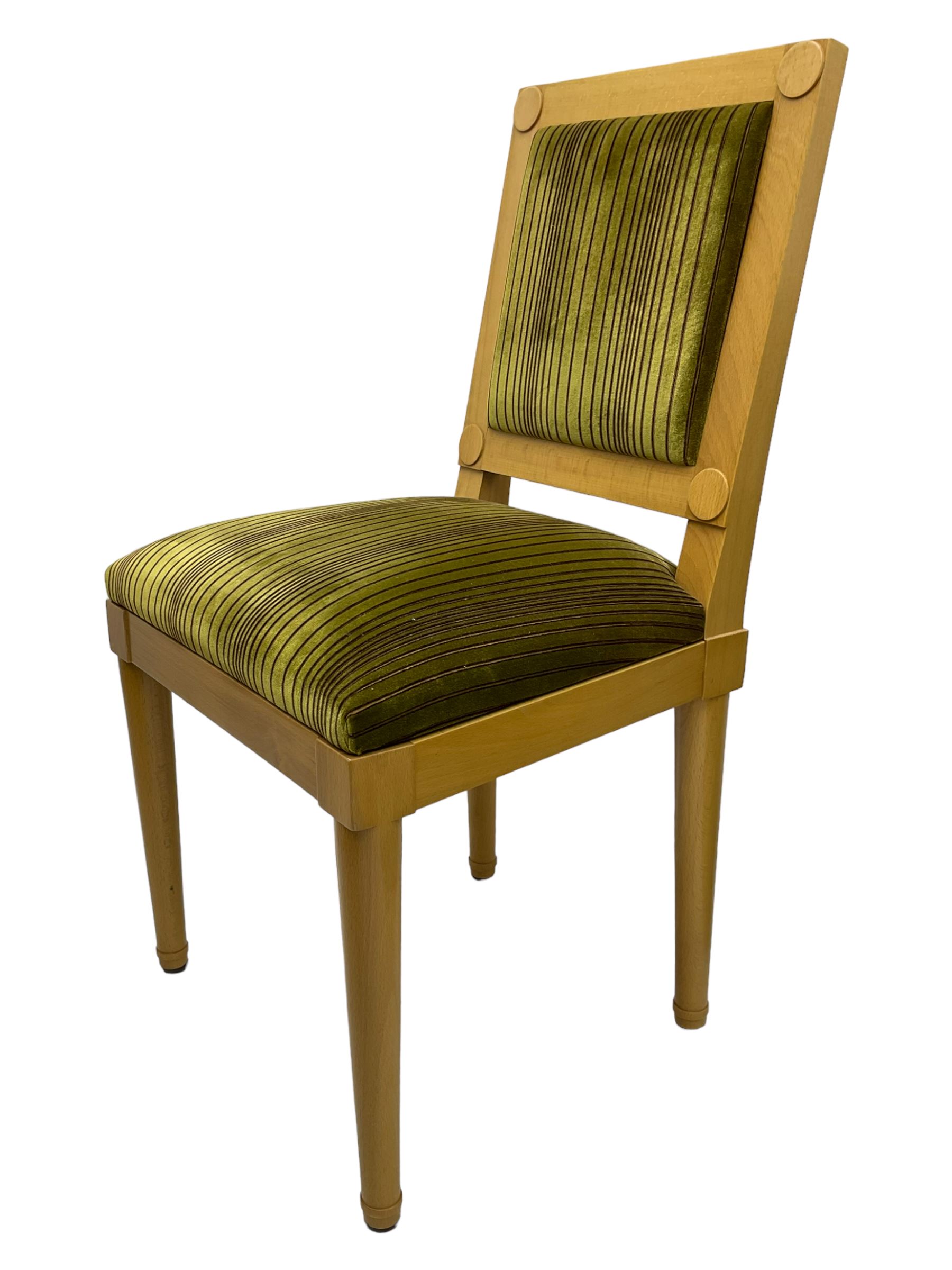 Contemporary beech and maple dining table, circular top on tapered cylindrical pedestal inlaid with rectangular panels, on circular base; together with set eight beech high back chairs upholstered in striped fabric, on turned supports 