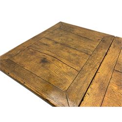 Early 20th century Jacobean design draw-leaf oak dining table, rectangular top with carved frieze depicting scrolling foliage and grape clusters, sliding extending leaves, raised on robust turned supports united by H-stretcher  