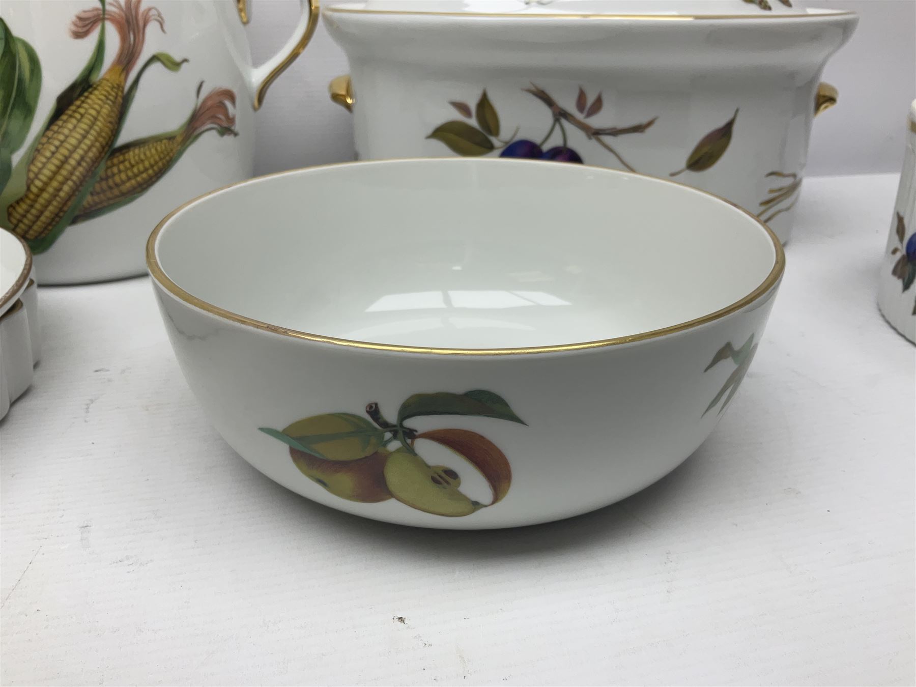 Royal Worcester Evesham pattern, including covered pot de cremes, twin handle tureen, serving dishes, flan dishes, side plates etc  