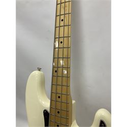 Fender Precision Bass guitar, in Olympic White finish with tortoiseshell effect scratchboard, serial no US15103092, in black Fender hard case with Fender strap and warranty card, guitar L116cm
