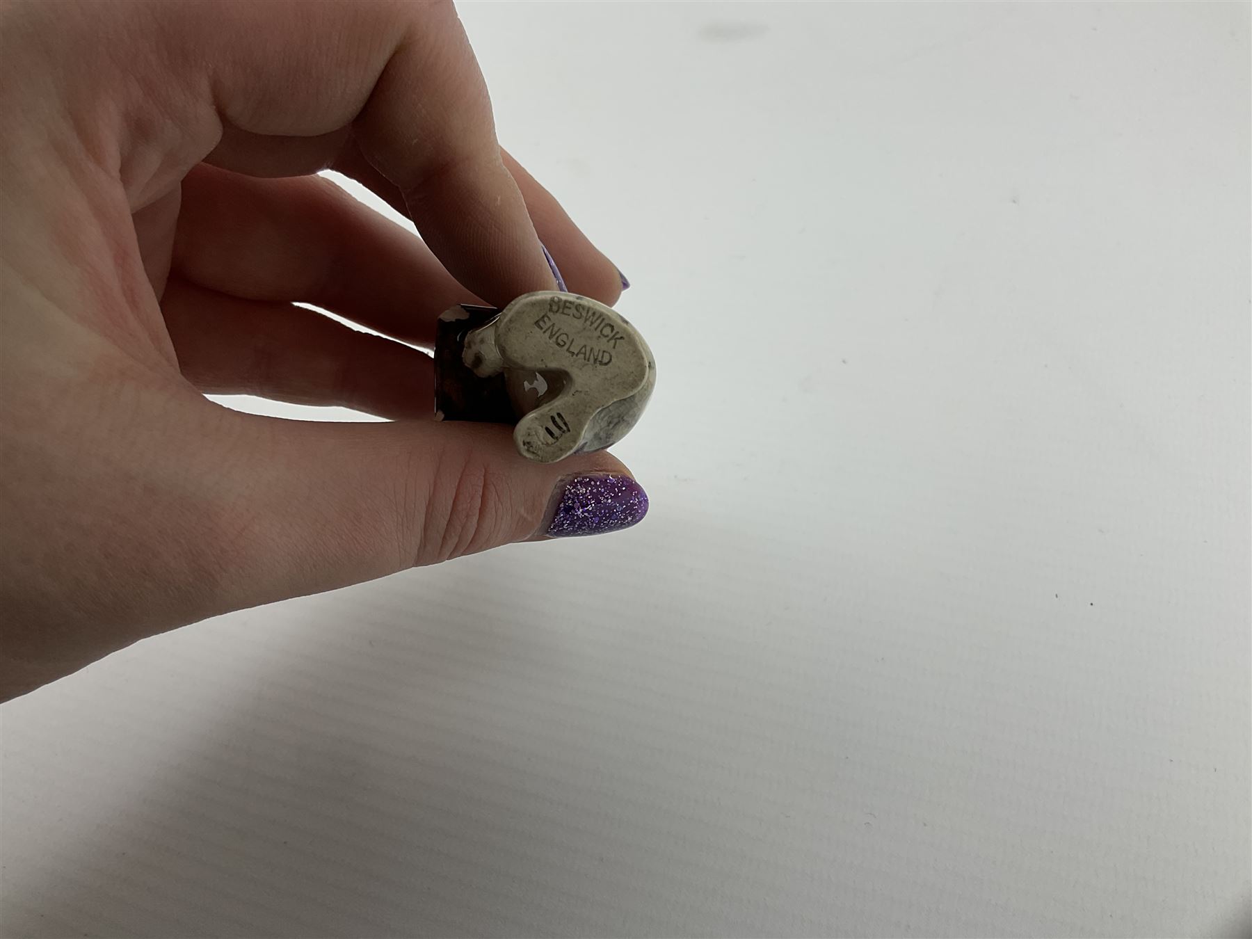 Victorian Wedgwood blue jasperware jardiniere H16.5cm; Victorian copper lustre jug; James Kent art deco style green glazed jug; and Beswick figure of a singing cat (4)