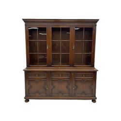 Waring and Gillow - oak bookcase on cupb