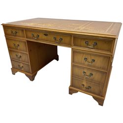 Georgian design yew wood twin pedestal desk, moulded rectangular top over nine cock-beaded drawers, on bracket feet