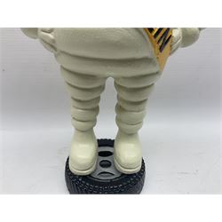 Cast iron figure of Michelin Man, stood on a tyre, H34cm 