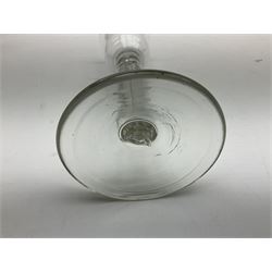 18th century cordial glass, the bucket bowl upon a stem with elongated internal tear and circular folded foot, H16cm