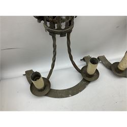 Gothic style iron chandelier with drip pans and twisted branches together with three matching twin wall sconces