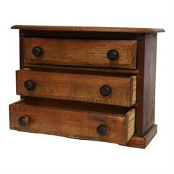 Table top chest of draws, fitted with three draws, upon a skirt base, together with another table top chest 