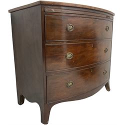George III mahogany bow-front chest, shaped top with satinwood stringing, fitted with brushing slide over three graduating cock-beaded drawers, shaped apron over bracket feet