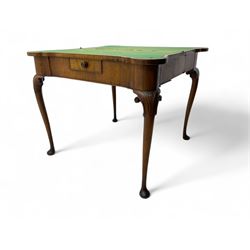 Georgian walnut fold-over card table, shaped rectangular top opening to reveal a baize-lined surface, supported by a concertina pull-out rear mechanism, frieze fitted with single drawer, raised on cabriole supports with foliate carvings terminating in pad feet