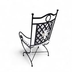 Wrought steel rectangular conservatory dining table, with glass top; and six, four side and two armchairs, with lattice backs and X framed bases, loose cushions