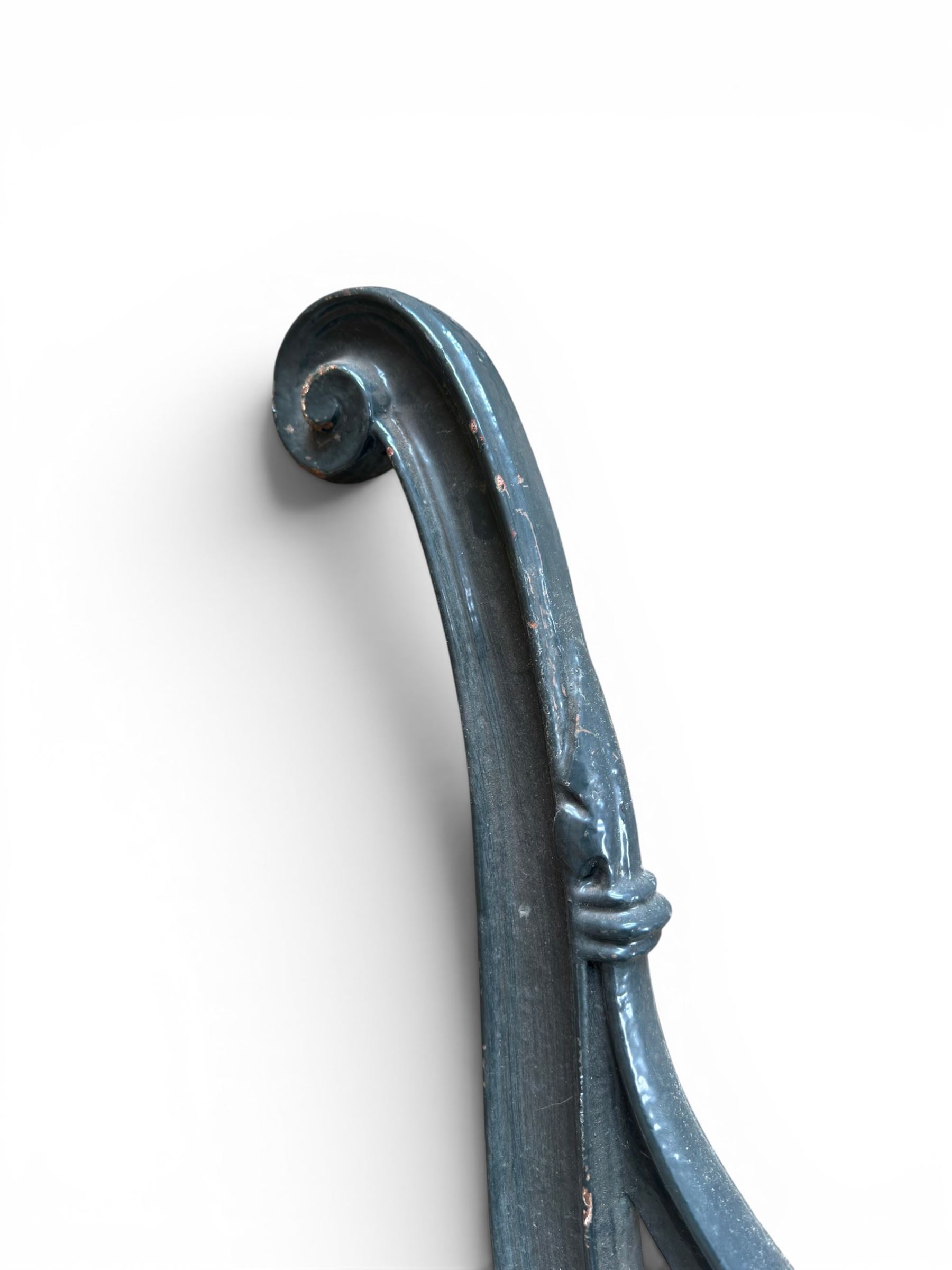 Yates Haywood - pair of 19th century cast iron bench ends, winged griffin detail, arched legs with rope turned decoration, finish in green paint, registration number 206550, first registered 8 March 1867 (see illustration), length as required