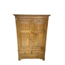 Traditional pine double wardrobe, fitted with two panelled doors over three drawers, on ogee feet