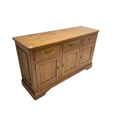 Willis & Gambier - oak sideboard, three drawers over three panelled cupboards, on bracket feet 