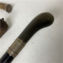 19th century painted bamboo walking cane, the handle carved as a fox with glass eyes, with gilt metal stamped LB, together with an ebonised wooden walking stick, with horn pommel and hallmarked silver collar and a curved wooden walking stick, with monogrammed white metal cap, tallest L90cm
