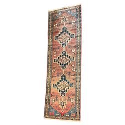 Persian Zanjan rug, red ground field decorated with three linked medallions, three band border with small repeating motifs