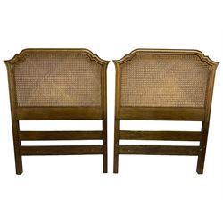 Pair of oak framed bergère headboards, moulded frames with stepped arched cresting rails