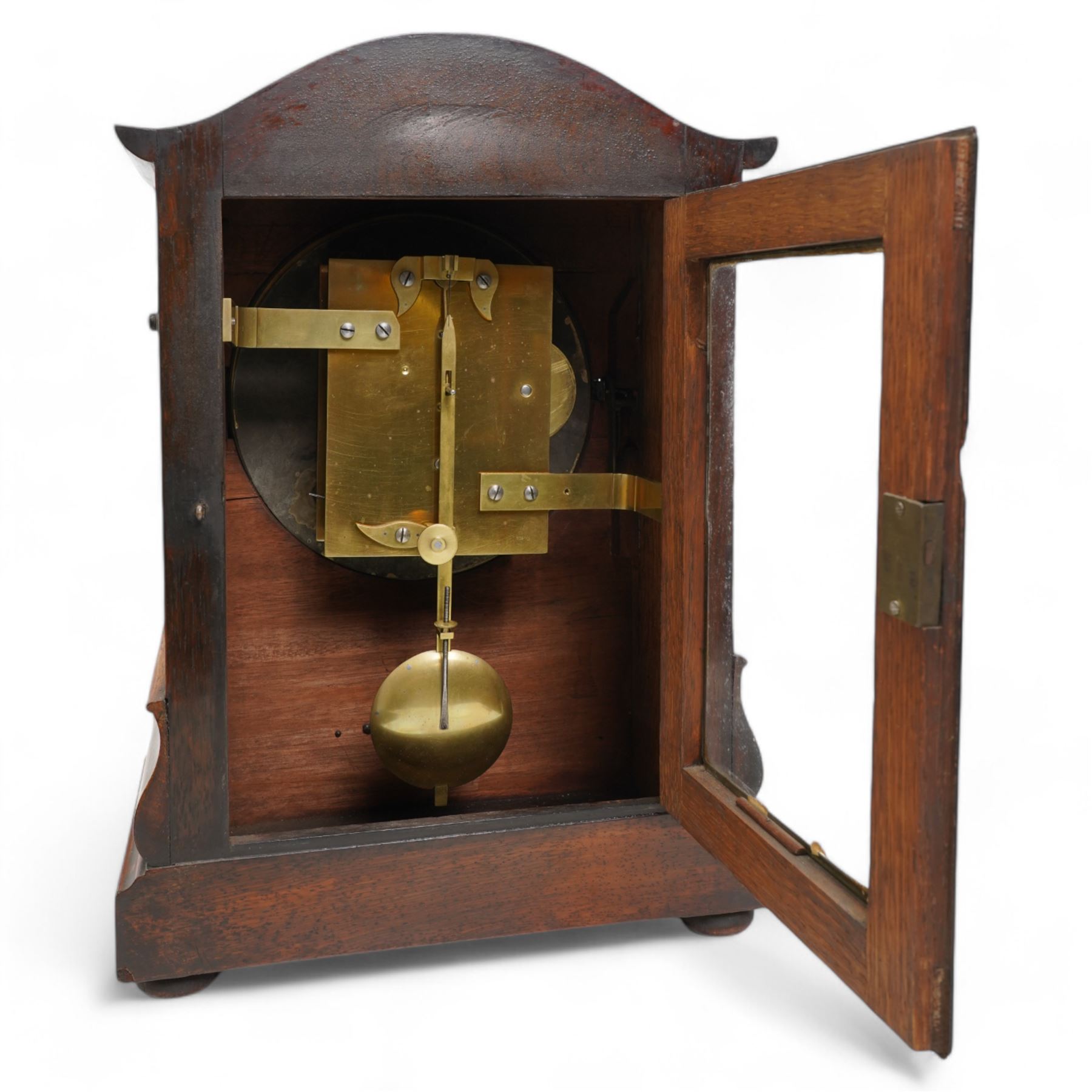 Brooks of London- Regency 8-day rosewood bracket clock c1825, with a serpentine shaped pediment and foliate carving on an ogee stepped base with bun feet, 8