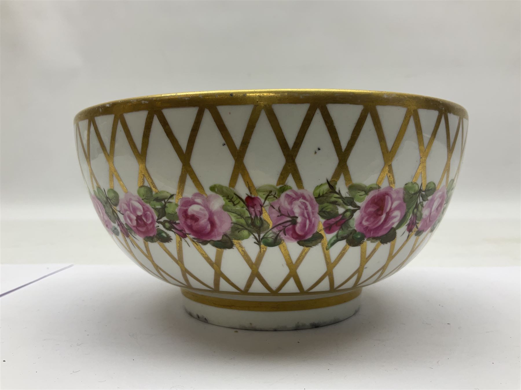 Group of 18th and 19th century ceramics for repair and restoration, to include an 18th century Derby figure emblematic of the Continent of Africa, pair of small 19th century Derby vases, painted with birds and floral spray, 19th century Derby slop bowl decorated in the 594 pattern with pink roses against gilt trellis, 19th century Derby figure of a recumbent deer, Serves style box, and two further figures