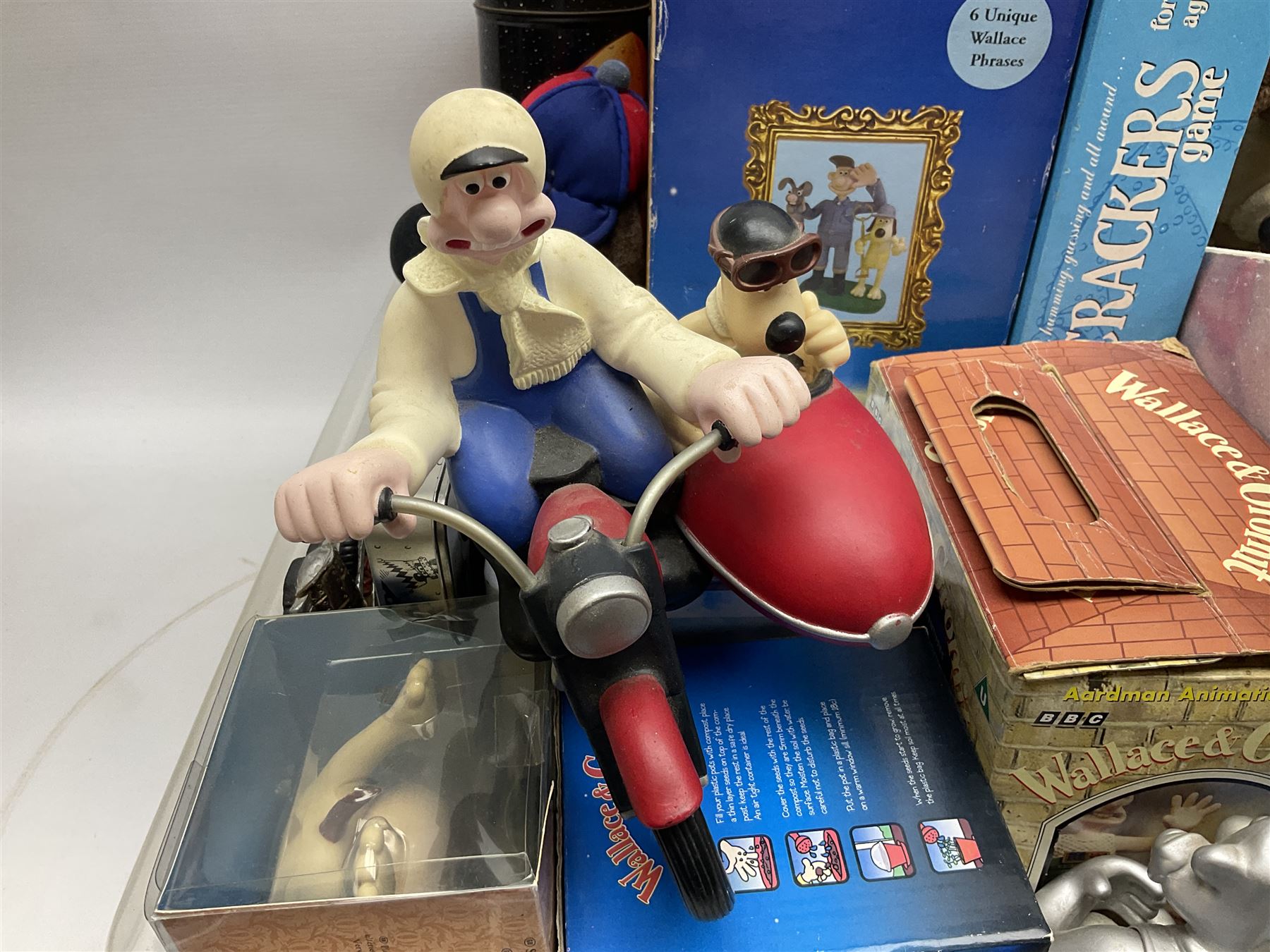 Large collection of Wallace & Gromit collectables, including four Born to Play  figures, clocks, composite figures, etc, in four boxes   