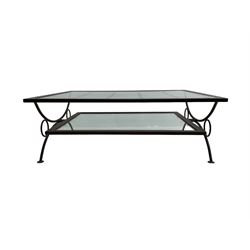 Wrought metal coffee table, curved x-framed base with glass inset top and undertier 