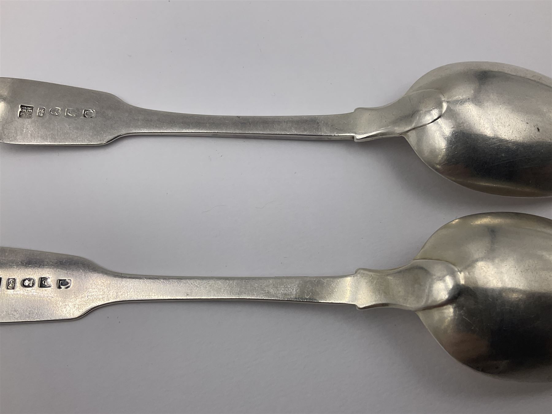 Pair of George III York silver Fiddle pattern dessert spoons, each engraved with a rampant lion crest, hallmarked James Barber & William North, York 1789