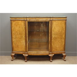  20th century figured walnut serpentine side cabinet, centre glazed door and two cupboards enclosed by quarter veneers doors, shell carved cabriole feet, W140cm, H110cm, D43cm  