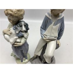 Four Lladro figures, comprising The Wanderer no 5400, Boy with Yacht no 4810, Can I Play? no 7610 and My Buddy no 7609, largest example H23cm