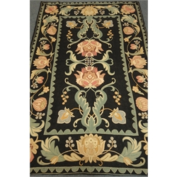  Kashmiri hand stitch wool rug, black ground, floral pattern, repeating border, 267cn x 175cm  