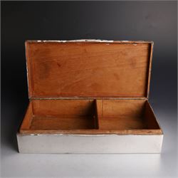 Two silver cigarette boxes, comprising early 20th century plain rectangular example with compartmentalised softwood interior, hallmarked Birmingham 1914, maker's mark indistinct, and an early 20th century example with engine turned decoration and engraved initials to cover, hallmarks worn and indistinct, largest H4.5cm, W21cm