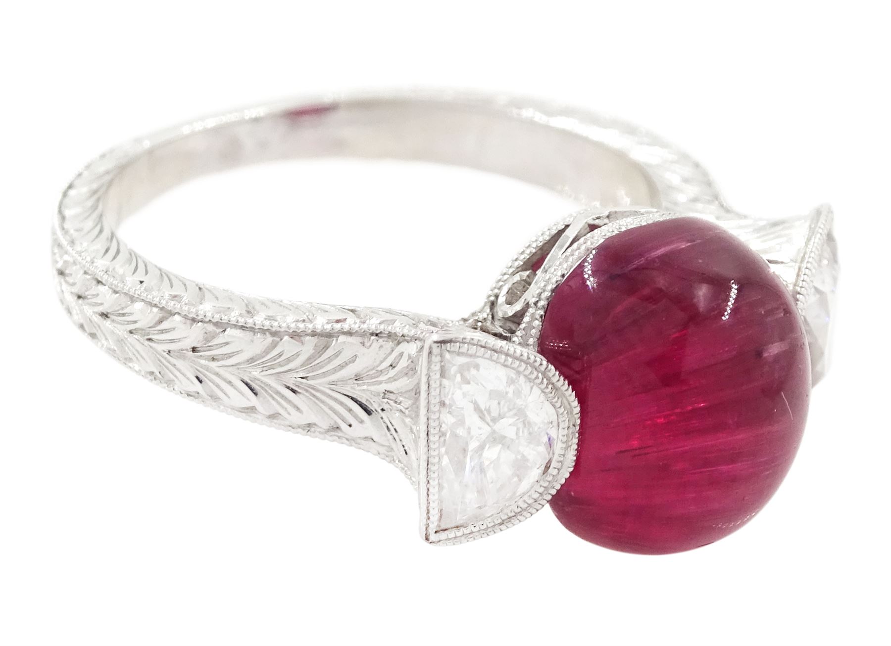 18ct white gold pink tourmaline and diamond ring, single oval cabochon cut tourmaline of approx 4.75 carat, set with a half moon cut diamond either side, to engraved laurel leaf design shoulders