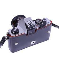 Three 35mm film SLR cameras, comprising Canon EOS 50E camera body with a Canon Ultrasonic EF 28-80mm 1:3.5-5.6 lens, together with a Canon EOS 600 camera body with a Sigma UC 28-70mm 1:3.5-4.5 lens and a Praktica MTL5 with a Carl Zeiss Jena DDR MC Flektogon 2.4/35 lens